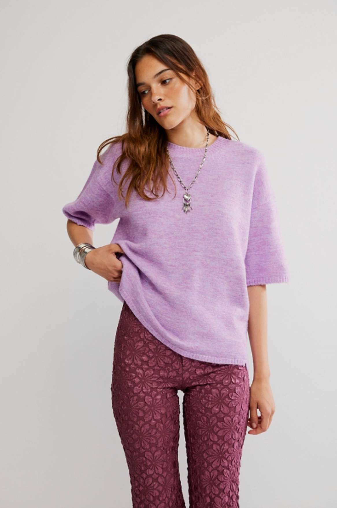 Model wearing Margot Sweater Tee in lavender, oversized short sleeve knit with crew neckline and ribbed trim.