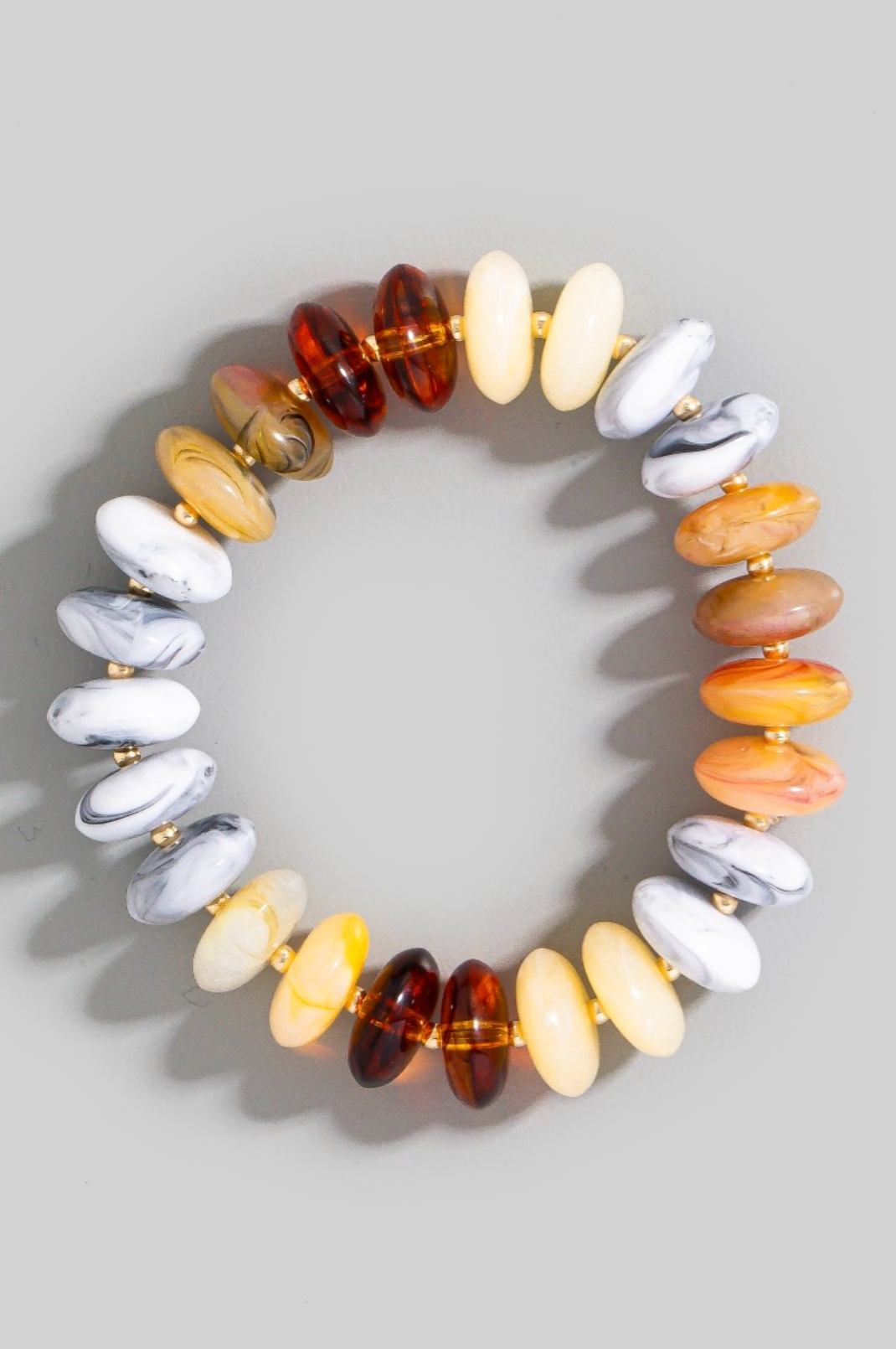 Multicolored beaded bracelet on a gray background