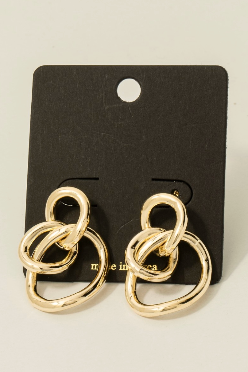 Gold sculpted loop statement earrings with linked abstract design