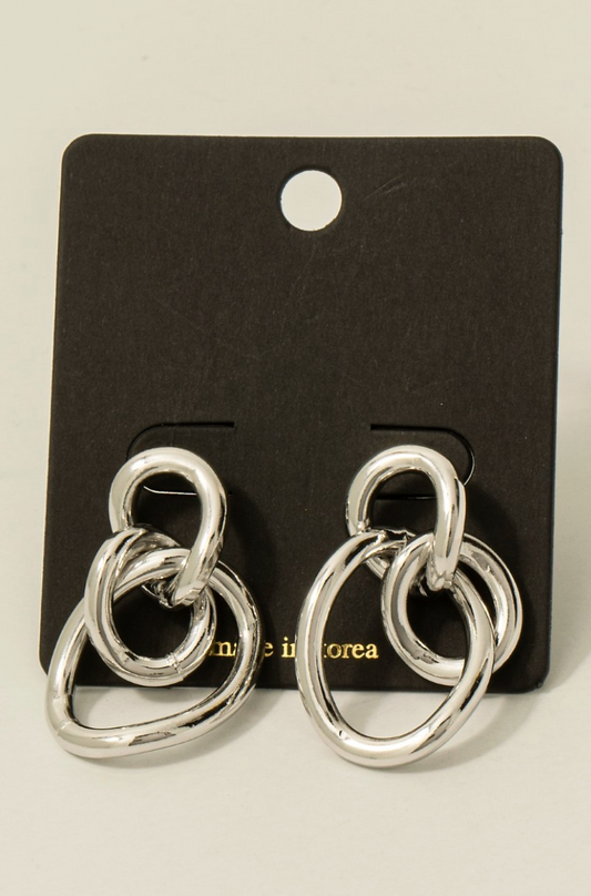 Silver sculpted loop statement earrings with linked abstract design