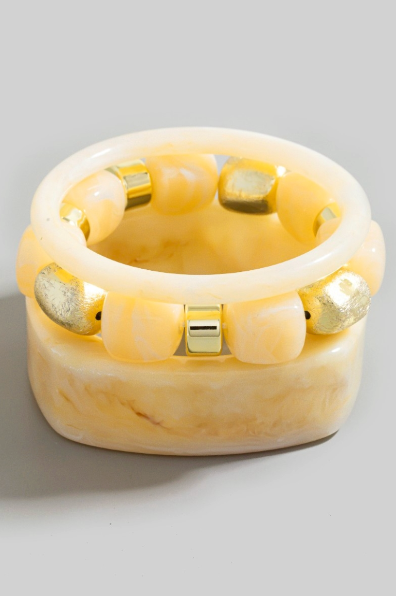 Calla Curve Bracelet Set in ivory marbled resin with gold bead bracelet