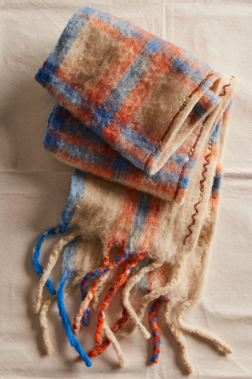 Ivory plaid fuzzy skinny scarf with blue and orange accents and beaded trim