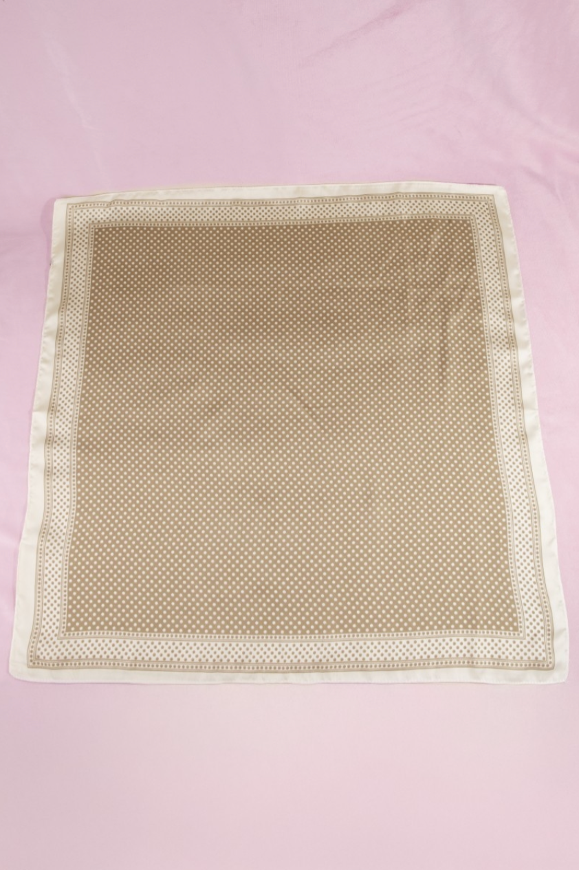 Beige satin square scarf featuring a micro white polka dot print with a coordinating ivory border.