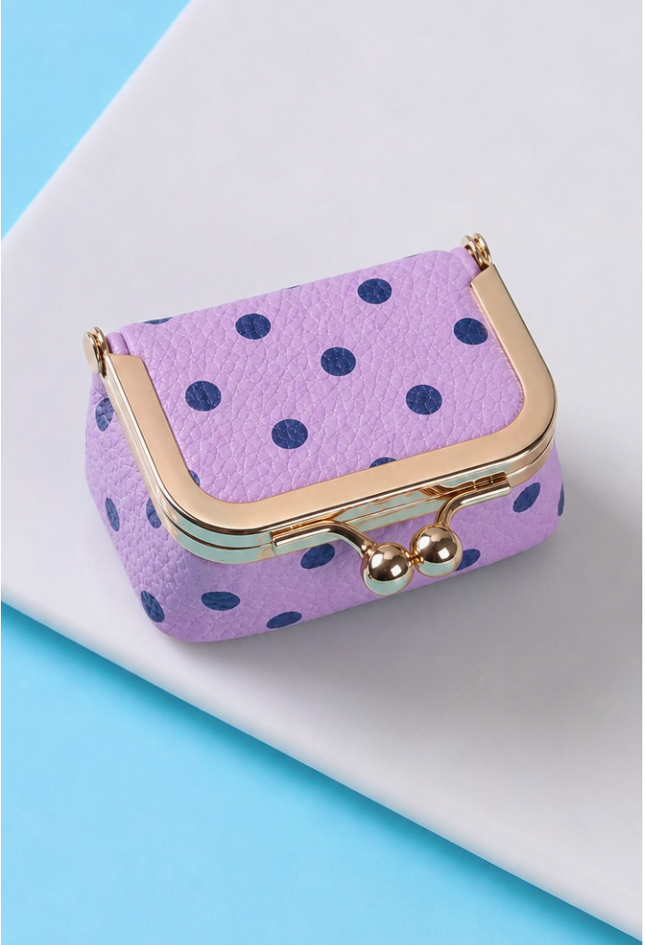 Missing Piece Travel Jewelry Box Lavender with navy polka dots, textured faux leather exterior and gold-tone kiss-lock closure.