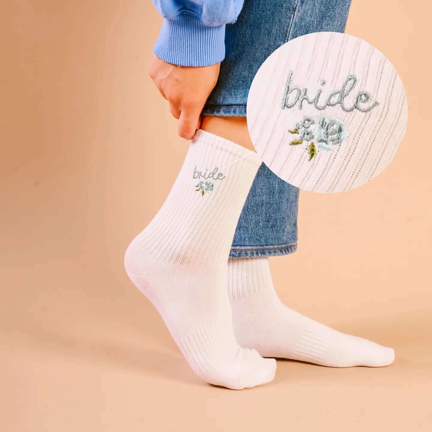 White crew socks with “bride” embroidery and blue floral detail for wedding day wear