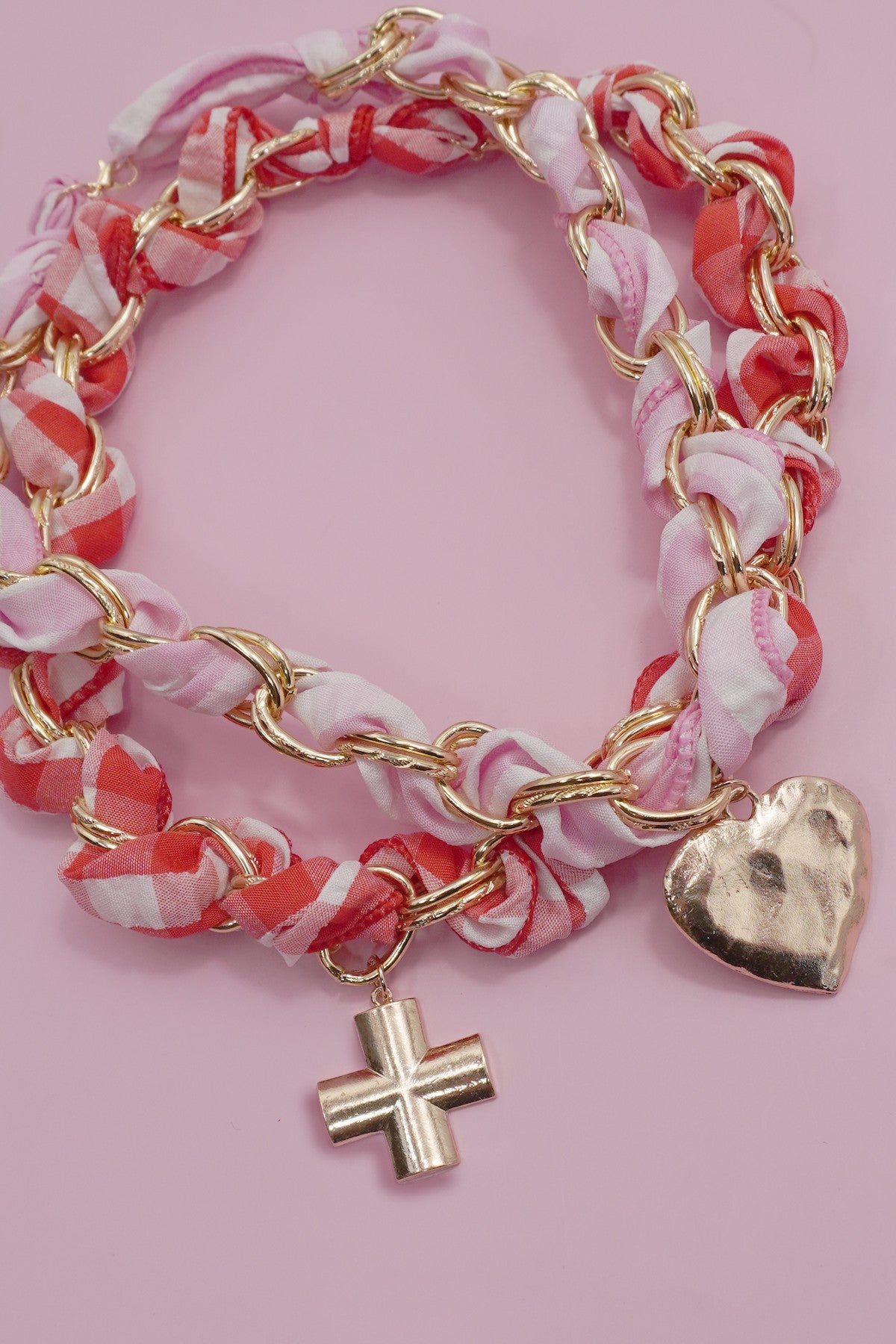 Lover’s Tide Charm Necklace with heart and cross pendants on scarf-wrapped gold chain