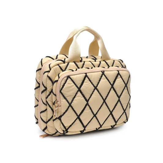 Beige toiletry bag with black geometric pattern on a white background