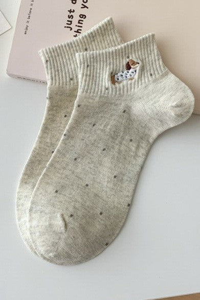 beige ankle socks with embroidered dog and dotted knit pattern