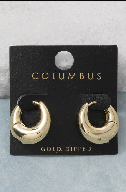 Gold dome huggie hoop earrings featuring a bold sculptural silhouette with a polished gold-dipped finish and hinged closure.