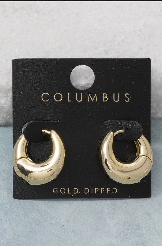 Gold dome huggie hoop earrings featuring a bold sculptural silhouette with a polished gold-dipped finish and hinged closure.