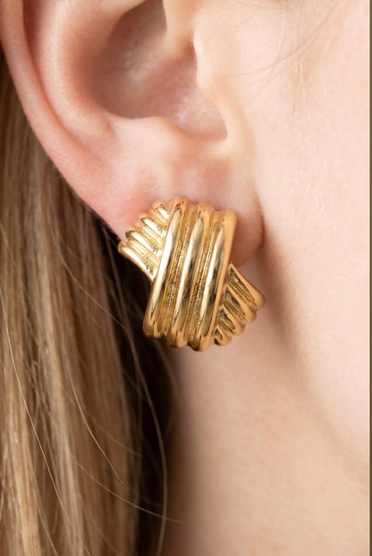 Gold-dipped X-shaped stud earrings with a ridged sculptural design and polished finish, perfect for everyday wear and statement styling.
