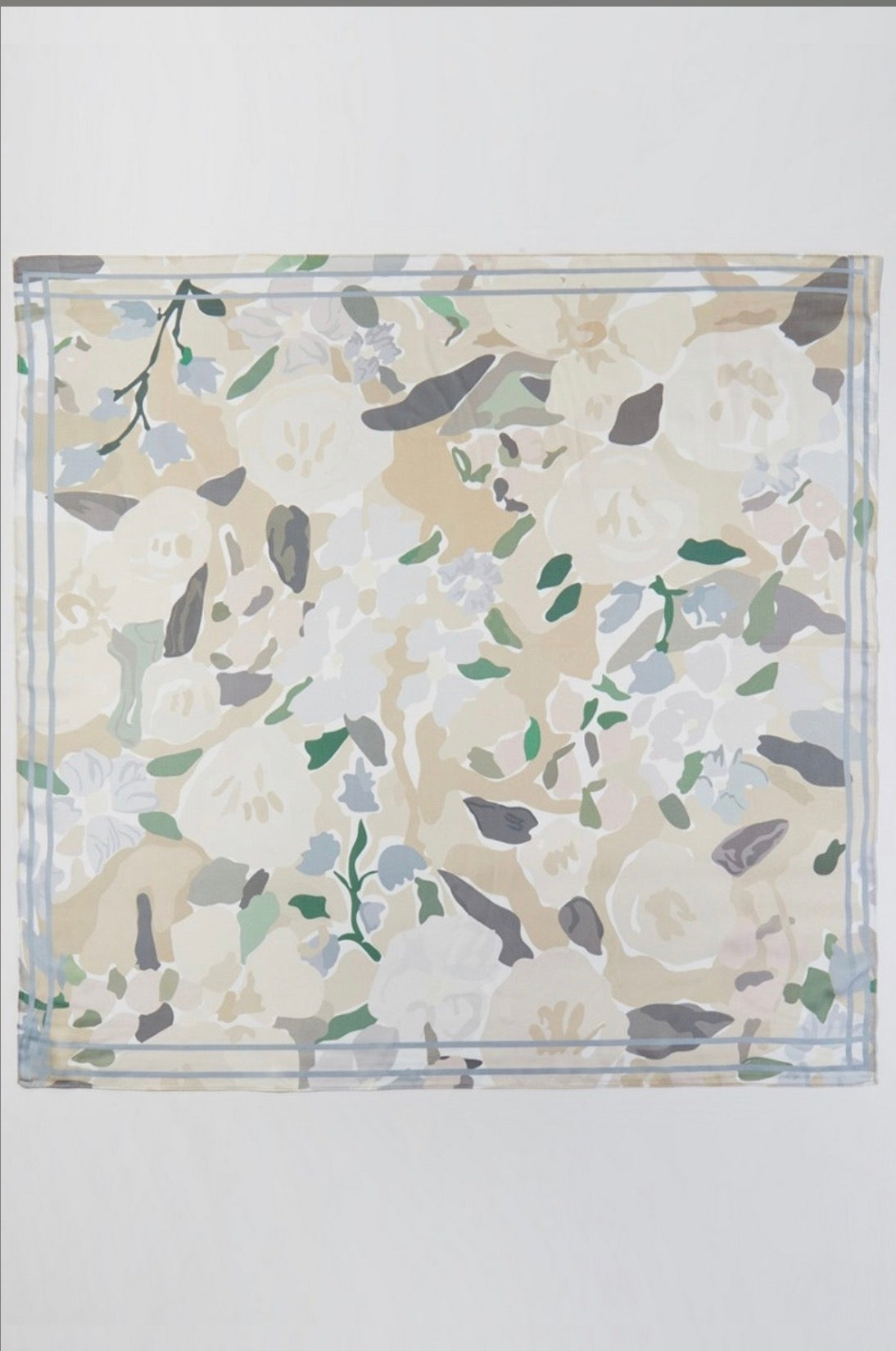 Square beige floral bandana scarf featuring an abstract ivory, sage green, soft blue, and taupe flower print with a delicate blue border.
