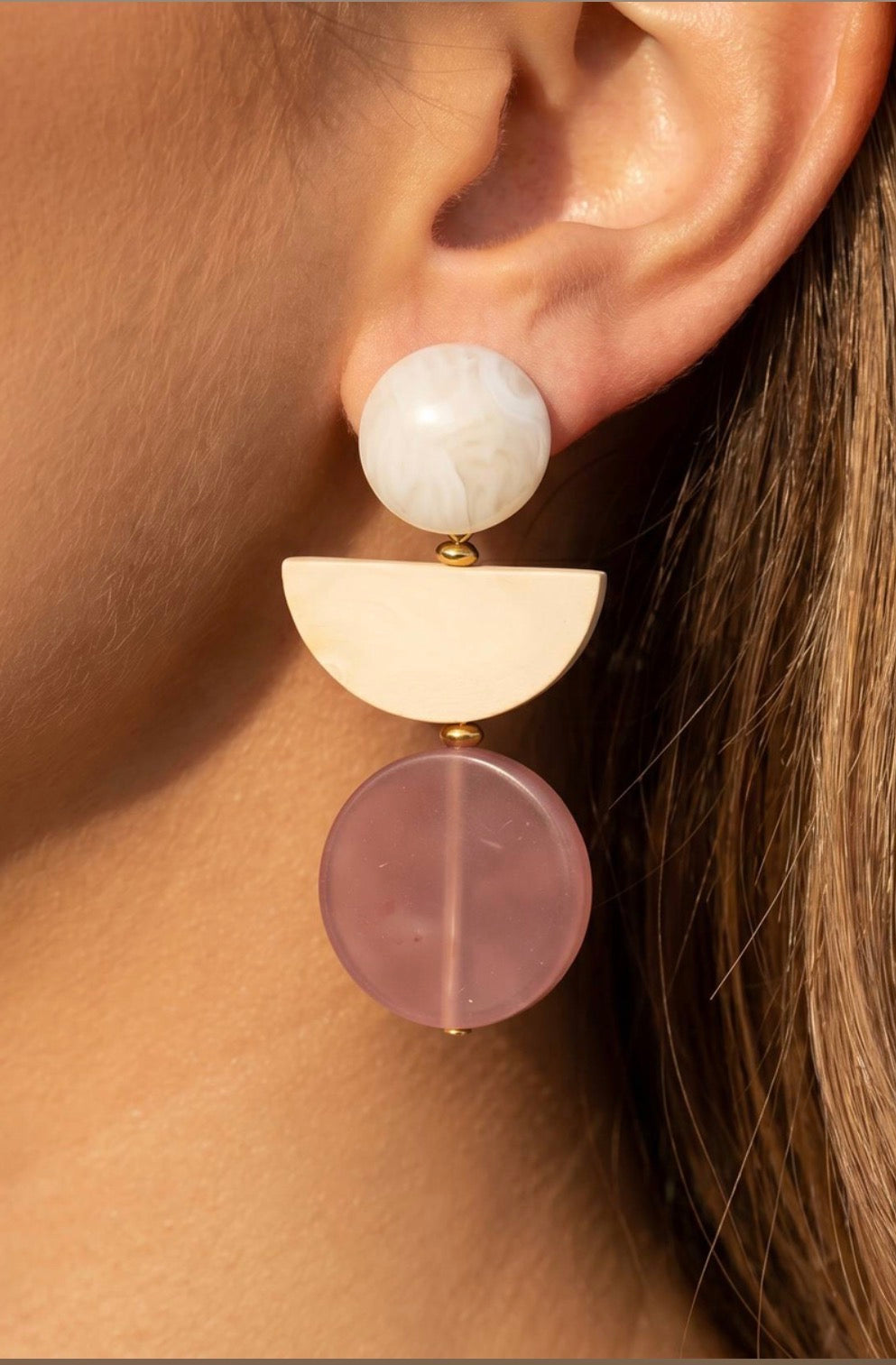 Pink geometric drop earrings featuring an ivory round stud, brushed gold-tone half-moon accent, and translucent dusty pink resin disc.
