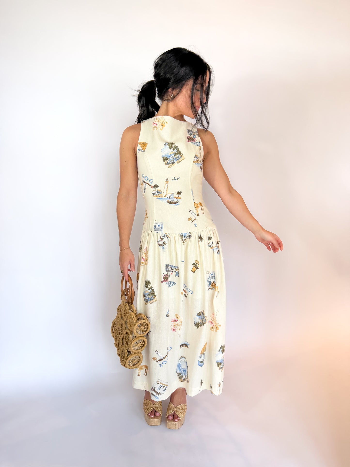 Woman wearing a floral dress with a plain background