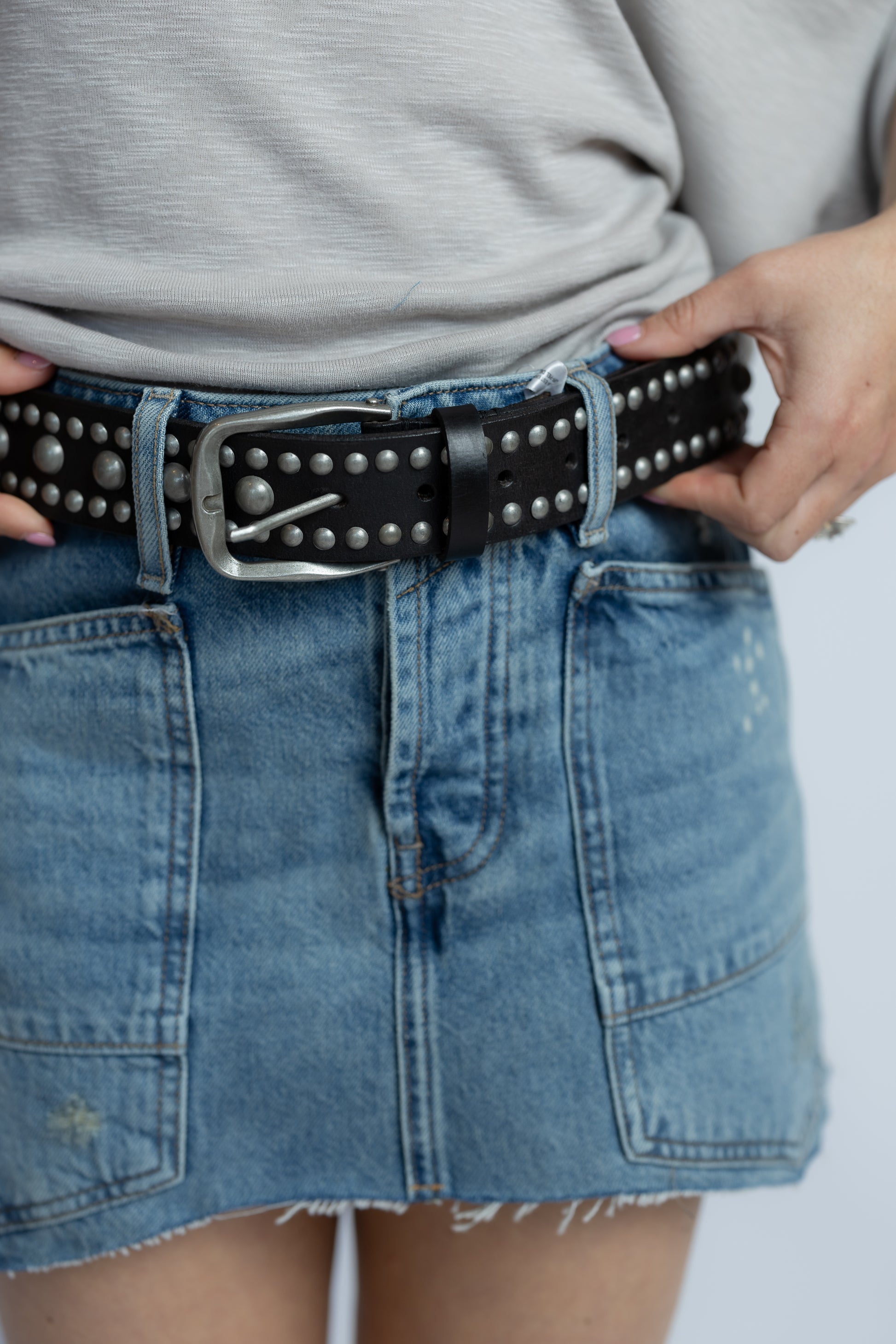 Free People Sola Stud Belt in Black featuring genuine leather construction and rounded stud embellishments throughout.