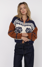 Load image into Gallery viewer, Model wearing Sweet Rose Jacquard Zip Sweater Jacket in navy, cream, and rust colorblock with floral jacquard design, styled with dark denim jeans.