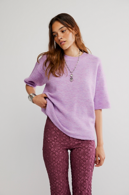 Model wearing Margot Sweater Tee in lavender, oversized short sleeve knit with crew neckline and ribbed trim.