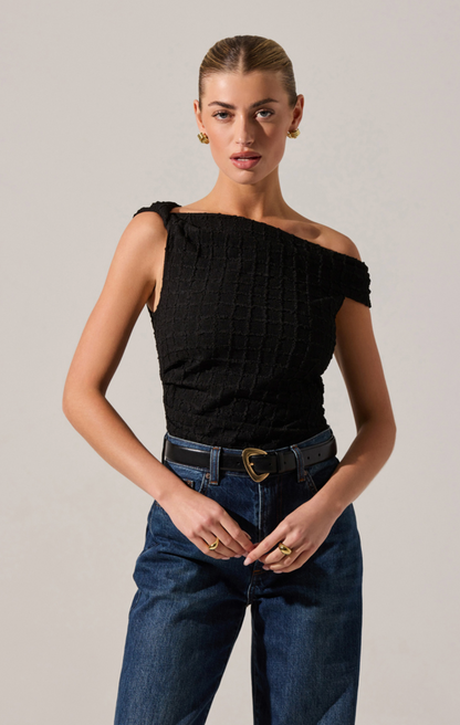Model wearing the Lindy Top in black with off-the-shoulder neckline, ruched texture, and fitted silhouette