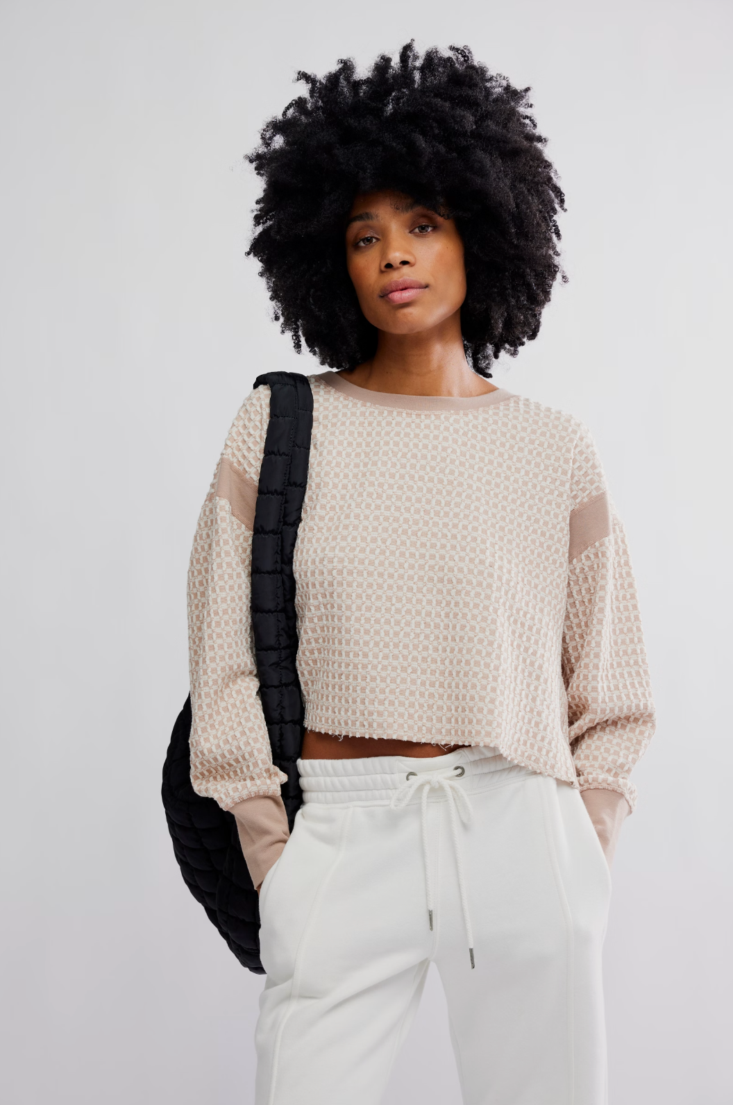 Woman wearing the My Time Textured Layer, a reversible textured pullover with cutout back and relaxed fit.