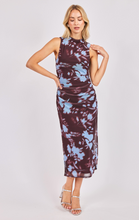 Load image into Gallery viewer, Woman wearing a sleeveless ruched abstract print midi dress in burgundy and blue tones.