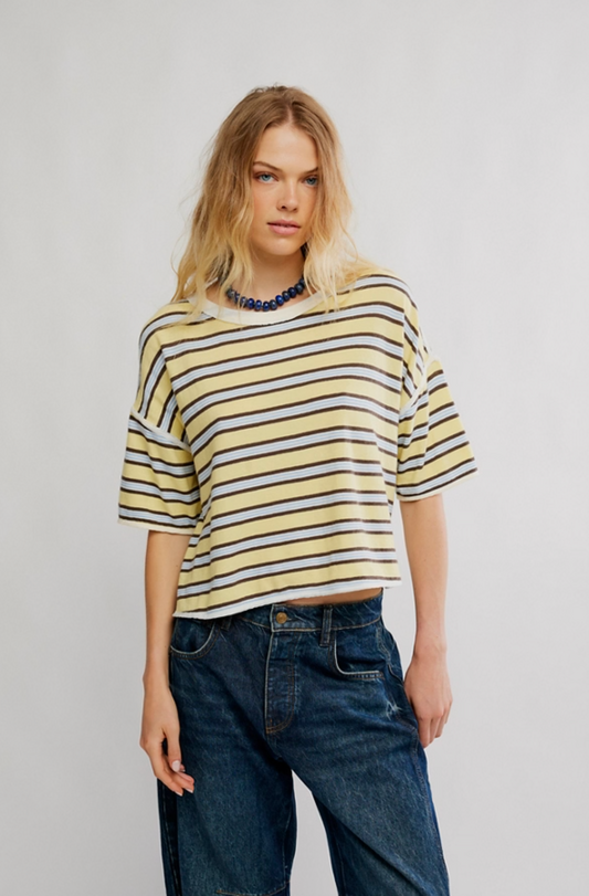 Woman wearing cropped striped Clean Rugby Tee with yellow and brown stripes and relaxed fit