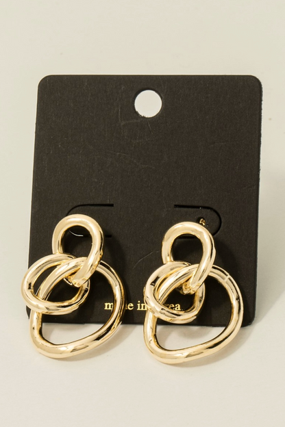 Gold sculpted loop statement earrings with linked abstract design