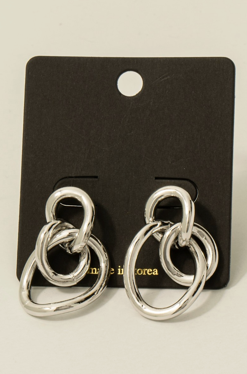 Silver sculpted loop statement earrings with linked abstract design