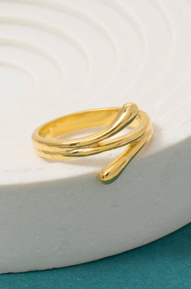 Gold double-wrap twist band ring with modern sculptural design