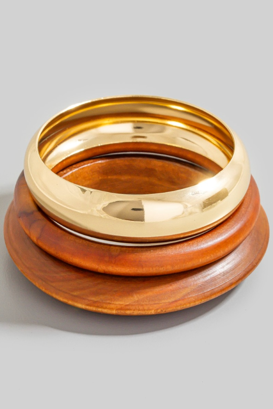 Three-piece wood and metallic gold bangle bracelet set
