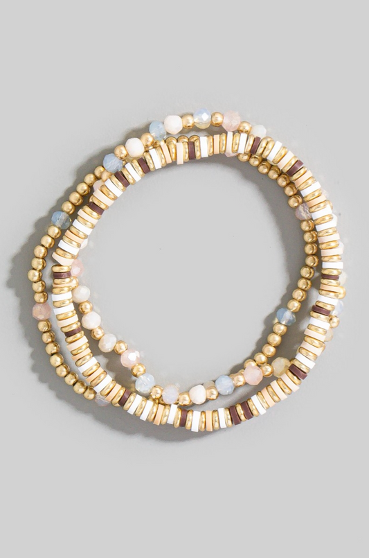 Mixed metallic and faceted beaded bracelet set with gold and pastel accents