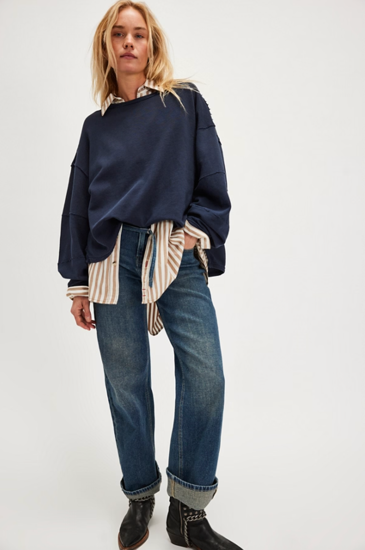 Model wearing navy Total Eclipse Tee layered over striped button-down shirt