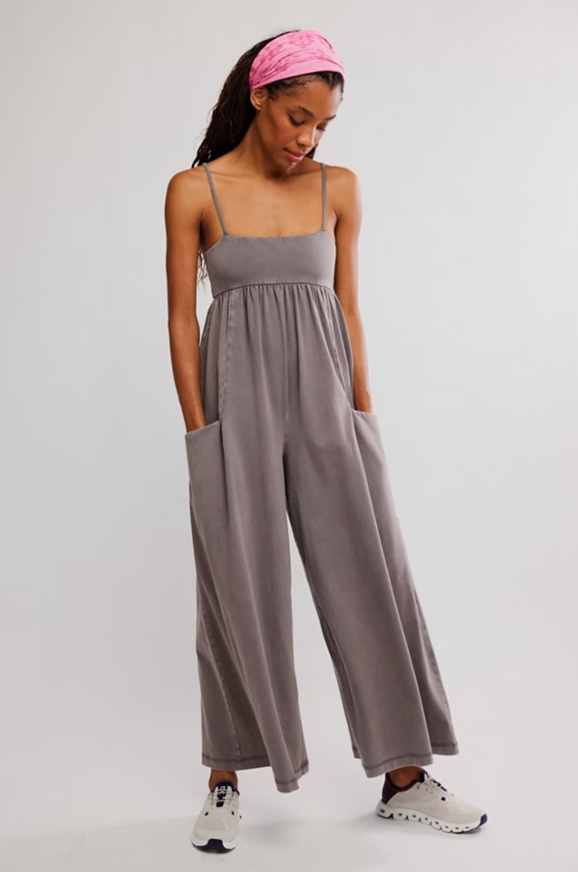 Model wearing grey Hot Shot Strappy Onesie with adjustable straps and wide-leg fit