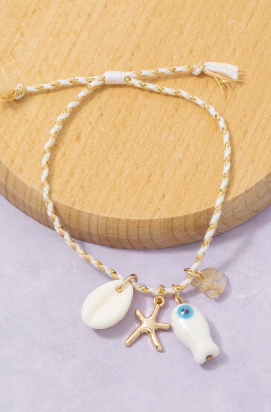 mixed metallic sea life charm cord bracelet with coastal-inspired details