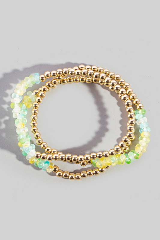 Set of beaded bracelets on a gray background