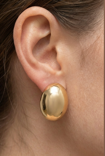 Polished gold oval dome stud earrings with a smooth high-shine finish.