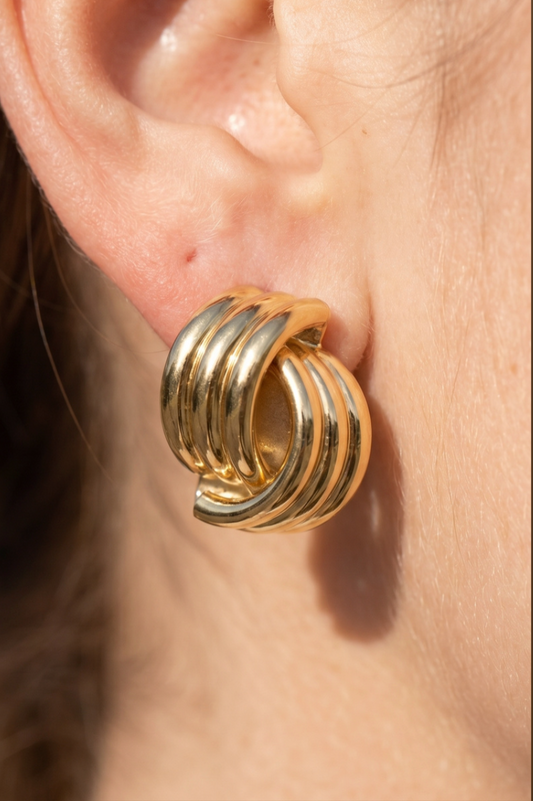 Gold-dipped sculptural cluster stud earrings featuring a polished rounded tube dome design.