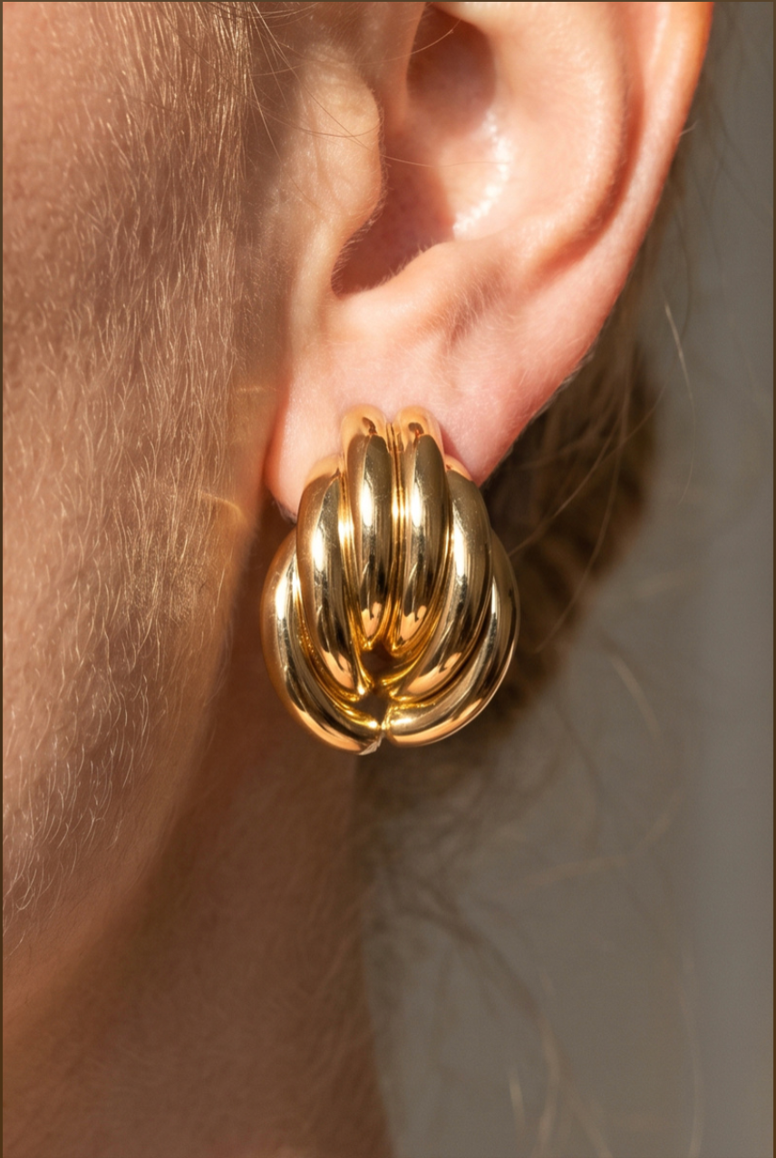 Gold-dipped triple tube cluster stud earrings with a polished layered sculptural design.
