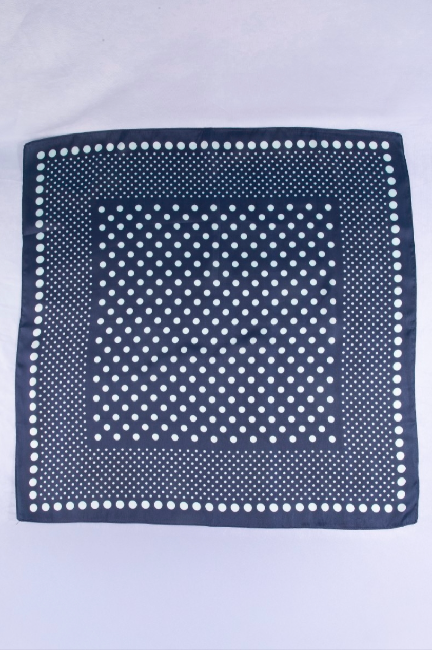 Navy satin square scarf featuring an ombré white polka dot print with a classic border design.