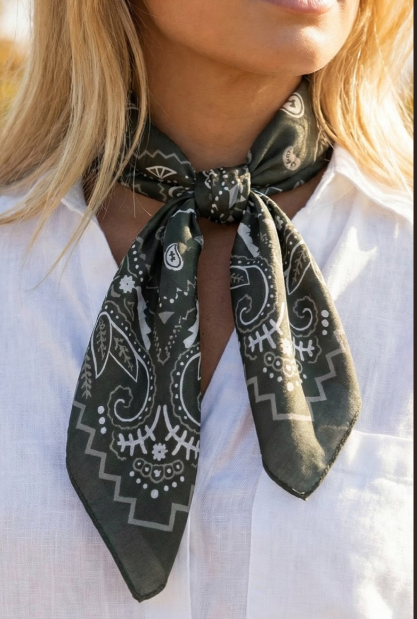 Black satin square scarf featuring a classic white paisley bandana print and decorative border.