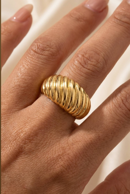 Chunky gold ridged croissant cuff ring with a polished finish