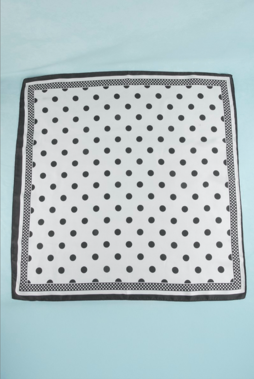 White satin square scarf with black polka dots and a coordinating dotted border.