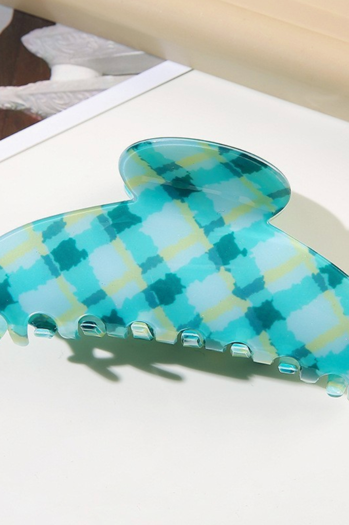 Large mint green checker patterned oval hair claw clip with oversized design for secure all-day hold.