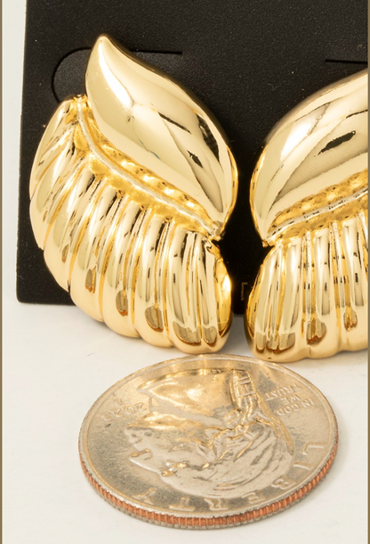 Gold-dipped wing-inspired shield stud earrings with sculpted textured detailing.