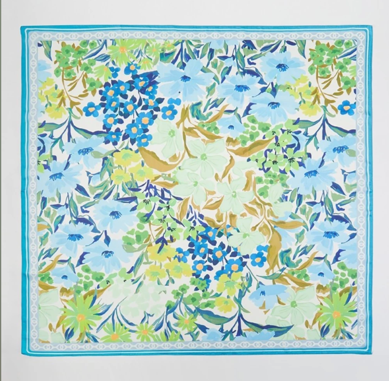 Square floral print scarf featuring blue, green, and yellow garden flowers with a turquoise border.
