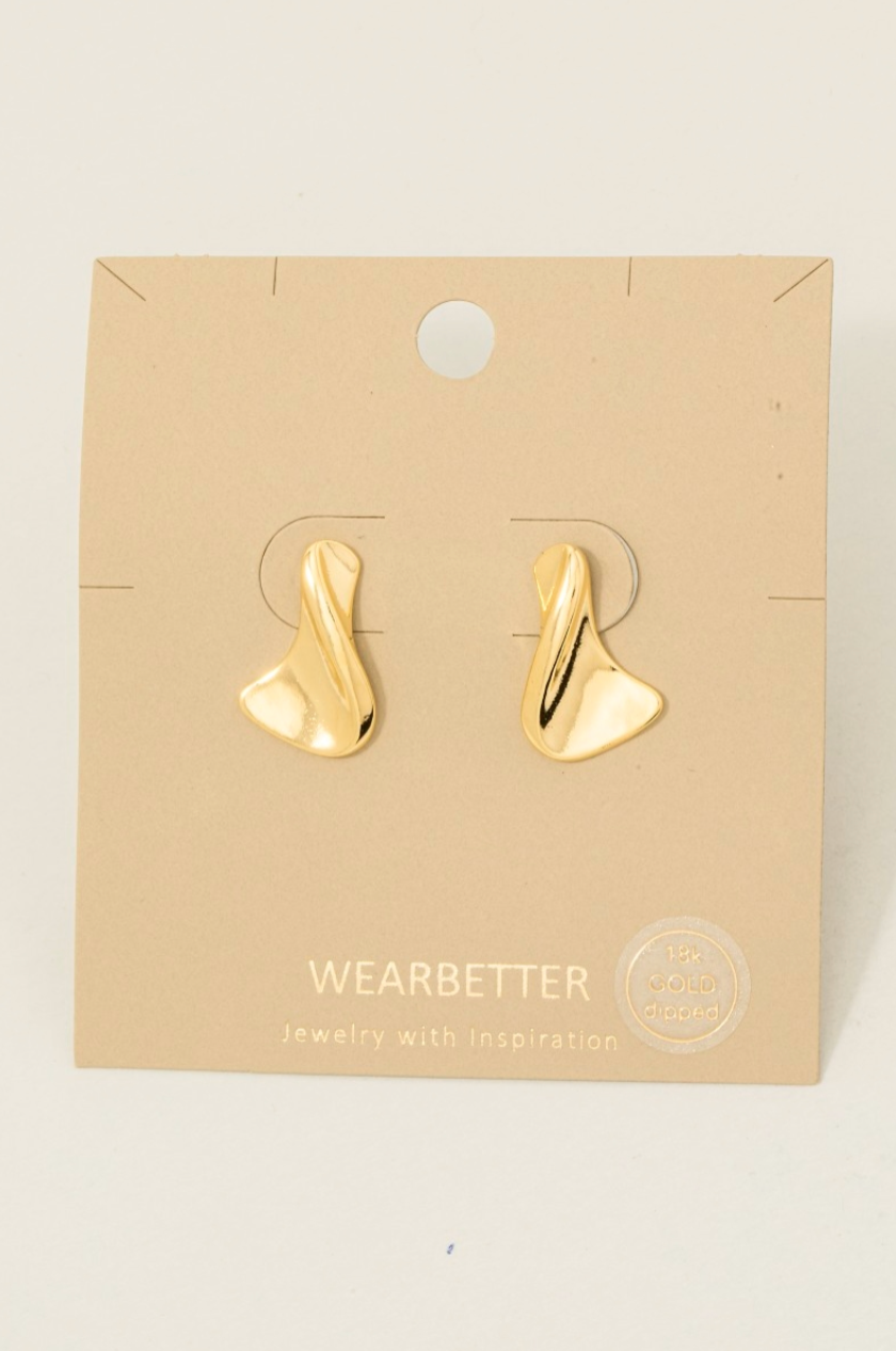 Gold dipped sculptural twisted drop earrings with a polished organic finish.