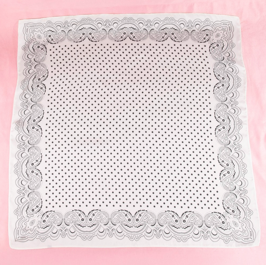 White satin square scarf with black paisley border and black polka dot print.