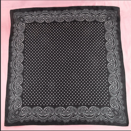 Black satin square scarf with white polka dots and a classic white paisley border.