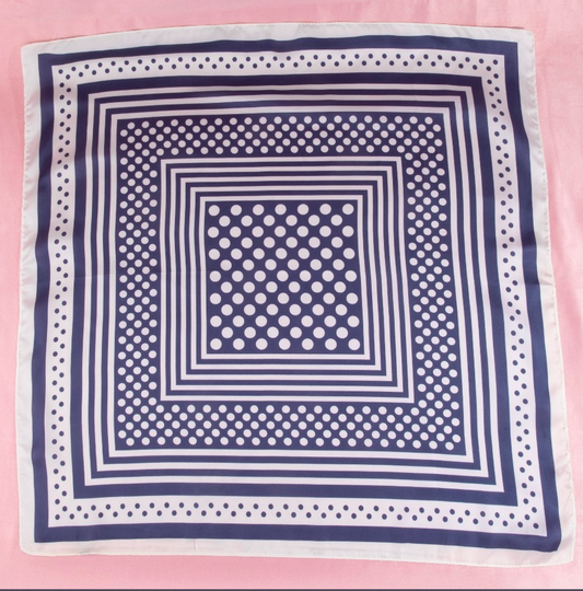 Navy satin square scarf featuring a concentric square design with white polka dot accents and striped borders.