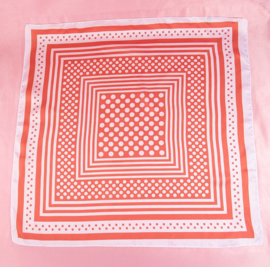 Red satin square scarf featuring a concentric square design with white polka dot accents and striped borders.