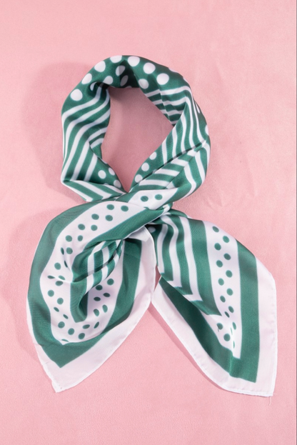Green satin square scarf featuring a concentric square design with white polka dot accents and striped borders.